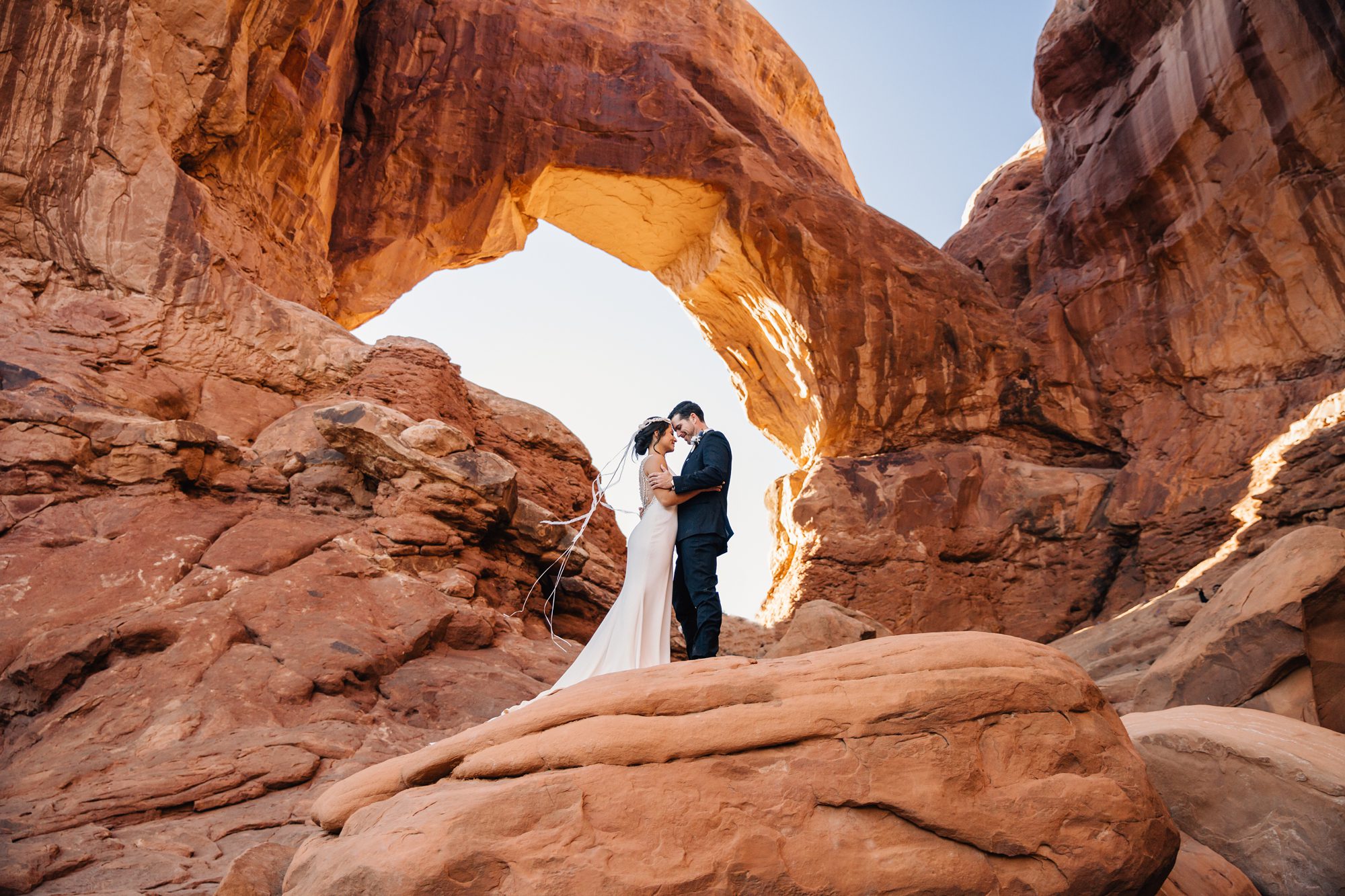 Bride and groom share a moment together after their elopement ceremony at Double Arch.