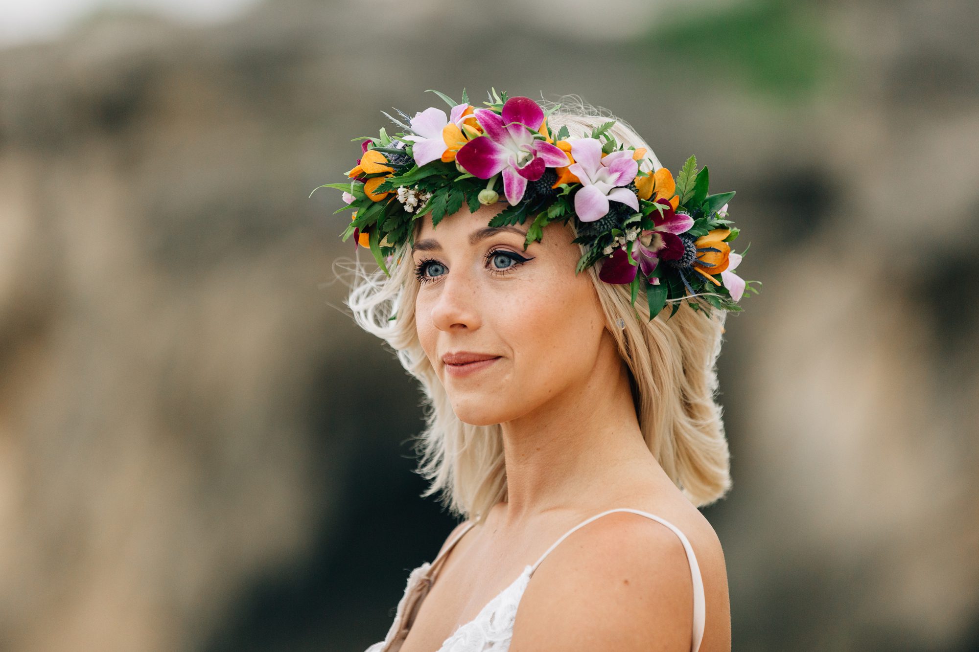 Bride with flower crown by Blue Orchid Floral Design Kauai.